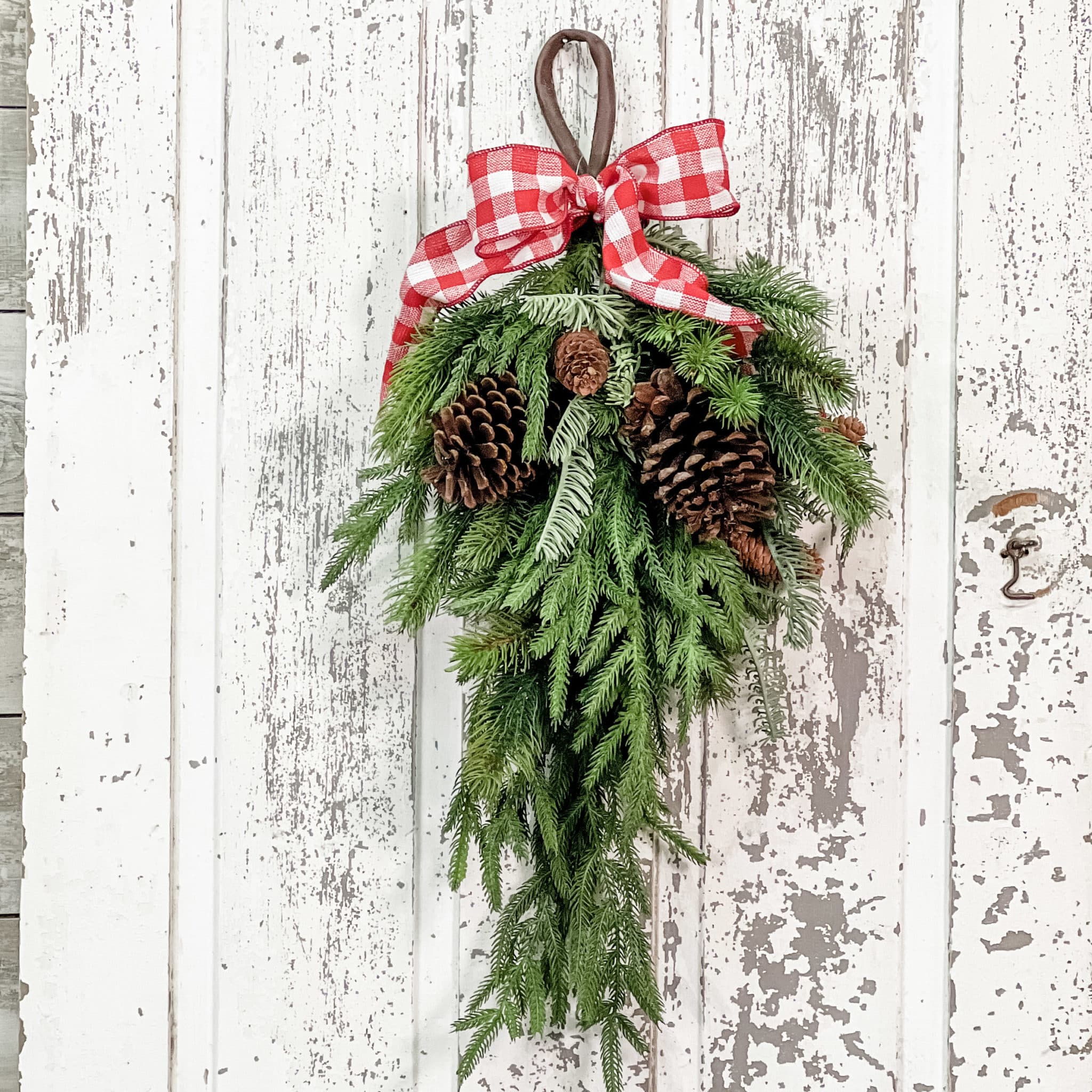 Evergreen spray with multiple real pinecones and loop for hanging